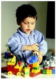 A Toddler Demonstrates His Fine Motor Skills By Grasping And Munipulating Building Blocks S Villeger Explorer Pho Fine Motor Skills Motor Skills Fine Motor