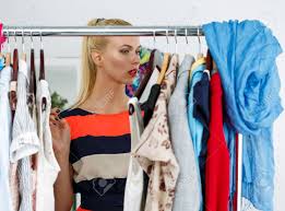 Your clothing will come out warm and dry within a few hours and it'll only cost a couple of cents per hour to use this product—a significant saving on running your own dryer or visiting the laundromat. Thoughtful Beautiful Blonde Woman Standing Near Wardrobe Rack Stock Photo Picture And Royalty Free Image Image 43203716