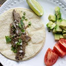To assemble, place shredded meat into a taco shell, then top with sliced radishes, diced avocado, onions, and cilantro. Instant Pot Beef Street Tacos Recipe Or Whatever You Do