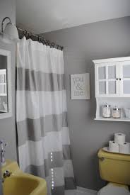 Grey Bathroom Kudos For Incorporating The Horrible Sink And Toilet I Mean Awesome Lol Reminds M Yellow Bathrooms Gray And White Bathroom Bathroom Makeover