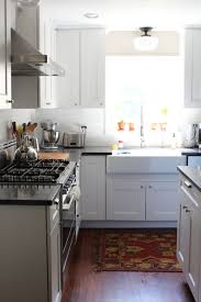 This Gorgeous White Kitchen Includes Martha Stewart Dunemere Cabinetry In Picket Fence From Handm With Images Kitchen Inspirations Martha Stewart Kitchen Kitchen Remodel
