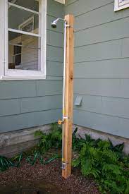 My outdoor shower is a simple spray hose mounted over a flagstone. 14 Best Outdoor Shower Ideas And Designs For 2021