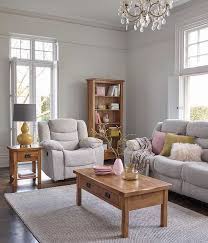 For a trendy california cool look, pair navy blue walls with a modern gray couch and plenty of wooden accents. How To Maximise Space In A Small Living Room The Ofl Blog