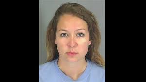 Deputy's wife charged again with domestic violence after beating him with  broom, officials say