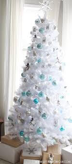 A tall shiny silver tree will perfecly fit a modern space, just add some lights for a sparkling look. Christmas Tree Decoration Ideas That Aren T Boring Simplemost