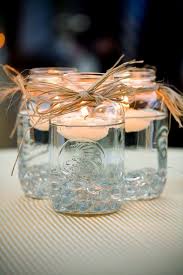 20 Of The Best Mason Jar Projects Floating Mason Jar Table Centerpieces With Images Mason Jars Jar Centerpieces Mason Jar Centerpieces