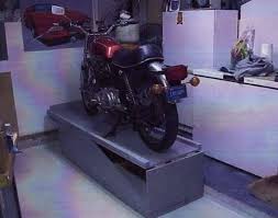 Homemade motorcycle lift constructed from wood. Wood Bike Stand Lift Plans Wood Bike Bike Stand Motorcycle Storage Shed