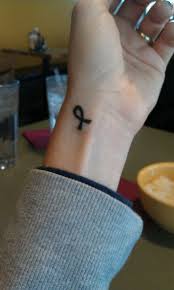 Green cancer ribbon wrist tattoo design. Pin On Melanoma