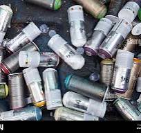 Empty paint spray cans used for graffiti and street art in a ...