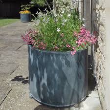 Clean and simple, the design is the perfect piece to refresh an empty corner or anchor small or large plants alike. Planters Garden Requisites