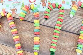 This is a really fun project and even though i made it up, i still had a lot of fun making it. Fruit Loop Candy Cane Ornaments Easy Kids Friendly Craft