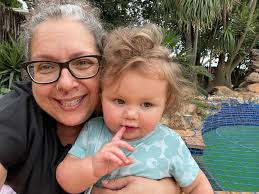 Family members sharing birthdays, celebrating granddaughter and daughter's  special day