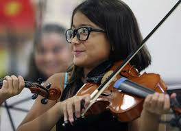 YOSA donates dozens of violins and cellos to San Antonio elementary school