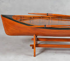Bring the adventurous spirit of the outdoors into your living room with a boat coffee table. Vintage Row Boat Coffee Table