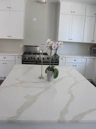Quartz with calacatta effect will give you even more than the real one; Countertop Pental Quartz Calacatta Cabinets White Shakers Contemporary Kitchen Cabinets White Shaker Kitchen Cabinets Kitchen Marble
