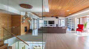This Tropical Minimalist Home By Valencia And Go Stands Out In Iloilo View of living room, staircase, kitchen and dini. tropical minimalist home by valencia