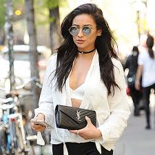 Her parents work in finance. Shay Mitchell