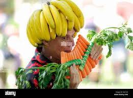 Man Wearing Fresh Raw Fruit And Vegetables Playing Pan Pipes Made Of Carrots Stock Photo Alamy