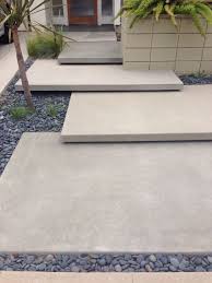 In this custom project, floating concrete stairs were made to lead into a basement home movie theater. Floating Steps Front Yard Design Concrete Steps Exterior Stairs