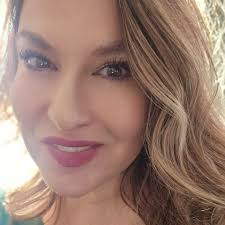 Moira: "Who do I look like?" Johnny: "I wanna say Tonya Harding."