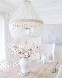 Coastal dining rooms are casual, bright, blue and modern; 15 Coastal Chandeliers For Beach Homes