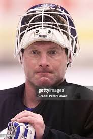 Glen Healy with his mask off, listening to Pat Quinn. The Toronto... News  Photo