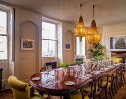 Dining room with wood burning stove, floor to ceiling sliding doors to deck. Pictures Of Beautiful Dining Rooms Homifind