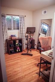 Workout Room And Office With Peloton Bike Expedit Shelf Mirra Chair And Loring Writing Desk Gym Room At Home Workout Room Home Small Home Gyms