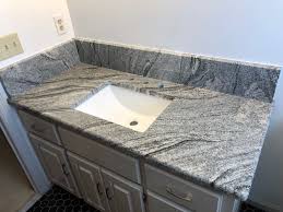 Wiscon White Granite Vanity Countertop Fabricated And Installed By Affordable Granite Cabinetry Granite Vanity Countertops Affordable Granite White Granite