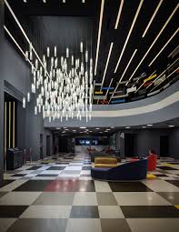 A Beautiful Modern Oversized Long Lobby Chandelier By Galilee Lighting Contemporary Custom Le Modern Chandelier Foyer Commercial Chandelier Modern Hotel Lobby