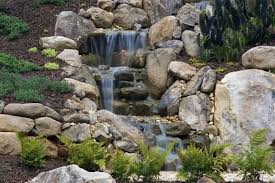 10 Stunning Landscape Ideas For A Sloped Yard Waterfalls Backyard Sloped Yard Backyard Landscaping
