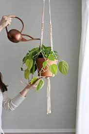 Now that you know how easy creating macramé crafts can be, try your hand at a macramé plant hanger to hold your beautiful potted plants. Diy Macrame Plant Hanger Hello Nest