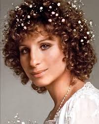 Barbra Streisand in A Star Is Born (1976). The film's narrative follows a  young singer who meets and falls in love with an established rock and roll  star, only to find her