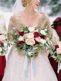Wintry bouquet with dahlias, scabiosa, blackberries, thistle and viburnum. Dark Red And Pink Winter Wedding Dark Red Bridesmaid Dresses Red And Pink Bouquets Colorsbridesmaid