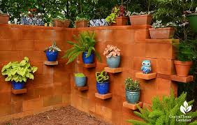 Drive long wooden stakes into the ground at each end. The Top 74 Cinder Block Ideas