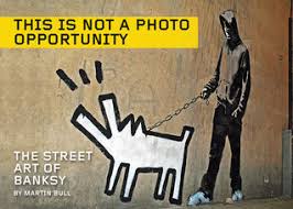 As banksy s cheerfully aggressive political work becomes ever more relevant, this comprehensive tome sets about presenting his art in the context of the era he was responding to. Coffee Table Look Books Shelf