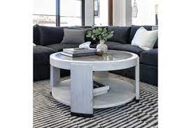 We recommend cleaning it by using a wet towel. Centre Round Coffee Table By Nate Berkus And Jeremiah Brent Living Spaces
