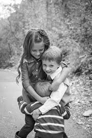 Black And White Kids Hugging Each Other Andersen With Images Fall Family Portraits Kids Hugging
