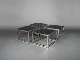 It is a contemporary end table that has got a square glass top and brushed chrome black rectangular base. Four Square Coffee Tables Soubrier Rent Tables Desk Coffee Table Xxth