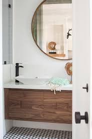Walnut/white sides of bathroom cabinets: Walnut Floating Sink Vanity With Round Brass Mirror Modern Bathroom