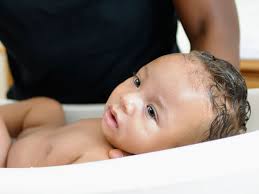 Cute snmiling baby taking bath in kitchen sink. Bathroom Safety Tips For Babies Kids Raising Children Network