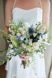 The twilight collection is a unique and rare mix of dusty blue, vibrant blue, silver, and white. Quaint Intimate Rustic Seaside Windmill Wedding Wedding Flowers Wildflowers Blue Wedding Flowers Spring Wedding Bouquets