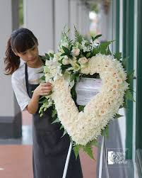 Gorgeous lilacs, blues and creams make this a very pretty funeral heart. Heart Shaped Condolence Wreath Funeral Flower Arrangements Funeral Flowers Condolence Flowers
