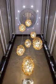 Soffione A 14 Metre Murano Glass Chandelier Spans Three Floors Of The Main Lobby Of Grand Millenni Murano Glass Chandelier Glass Chandelier Lighting Fixtures