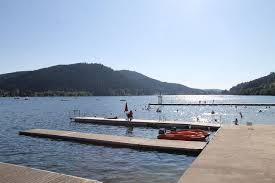 Swimming In Gerardmer In A Lake Vosgien Like No Other In 2020 Lake Pedal Boats Water Park