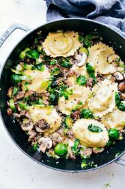 Spicy Italian Sausage Garlicky Brussels Sprouts Cremini Mushrooms Tossed With Parmesan And Black Peppe Italian Sausage Recipes Italian Sausage Pasta Dishes