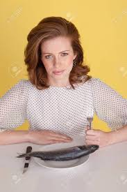 Upset Woman Holding Her Fork In Her Fist And Looking Angry About Stock Photo Picture And Royalty Free Image Image 12587801