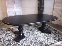 There's a buffet table on the side topped with glass table lamps. Black Extending Pedestal Dining Table Entri Ways