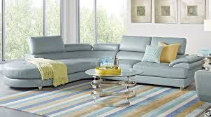 Blue chairs and a blue couch give the feeling of a blue living room, even if the walls are white. Blue White Yellow Living Room Furniture Decorating Ideas