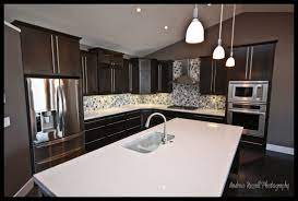Building New Homes In Central Alberta Larkaun Homes Kitchen Remodel White Quartz Counter Glass Mosaic Backsplash